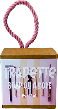Tradette Soap on a Rope gift box featuring a pink rope handle and a kraft paper top, with a front label reading 'Tradette SOAP ON A ROPE sweet as'.