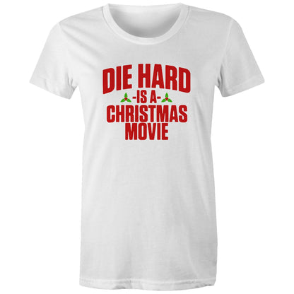 A black women's t-shirt with the text 'DIE HARD IS A CHRISTMAS MOVIE' printed in red and white.