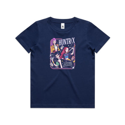 A close-up of a graphic t-shirt featuring three illustrated anime-style female characters with colorful hair and outfits, surrounded by stars and the text 'HUNTR/X'.