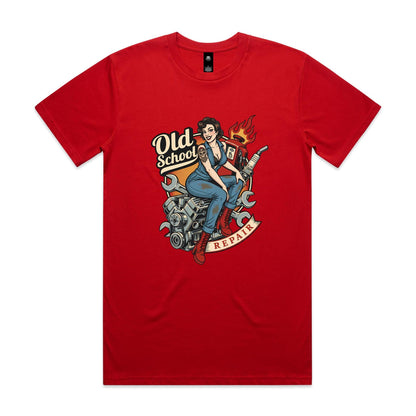 A vintage-style pin-up illustration printed on a white garment, showing a woman in blue overalls and red boots sitting on a motorcycle engine with wrenches, a gas pump, flames, and the words 'Old School' and 'REPAIR'.