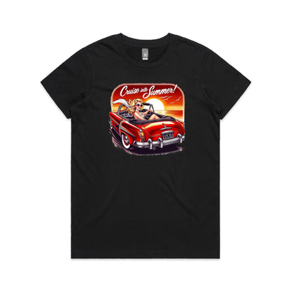 A graphic print on a black t-shirt featuring a retro-style illustration of a blonde woman in a red convertible car at sunset, with the text 'Cruise into Summer!' above.