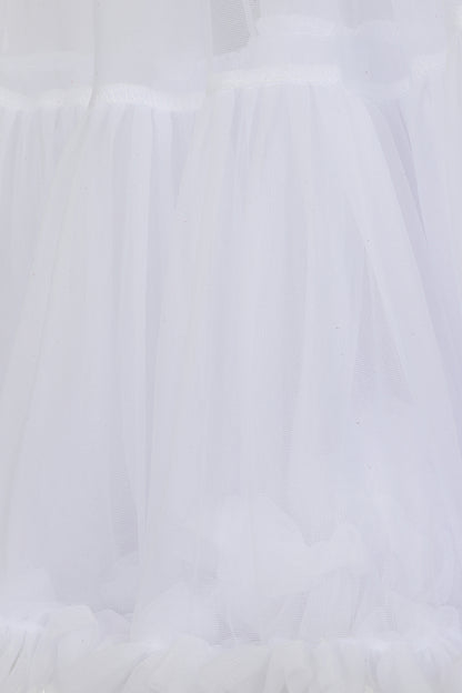 White ruffled tulle fabric close-up, showing layered sheer mesh and gathered texture.