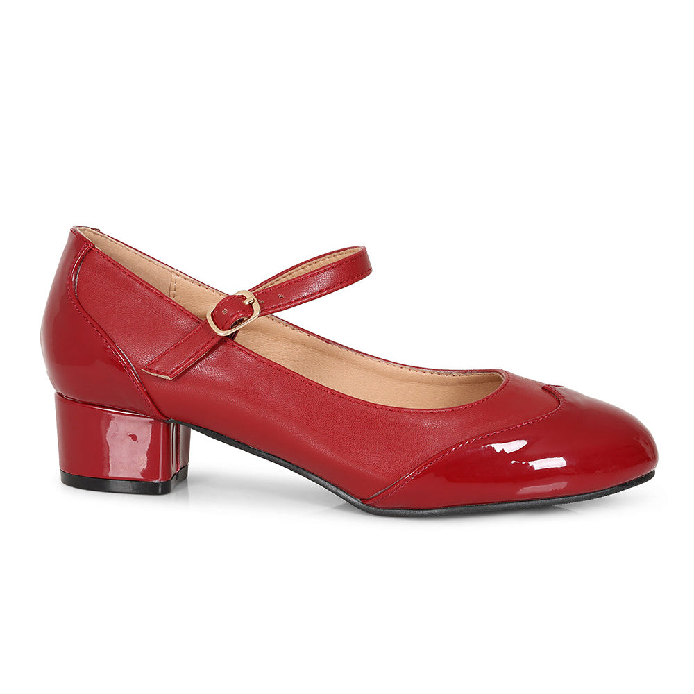 A single red patent leather Mary Jane pump with a low block heel and a small gold buckle, shown from a side profile on a white background.