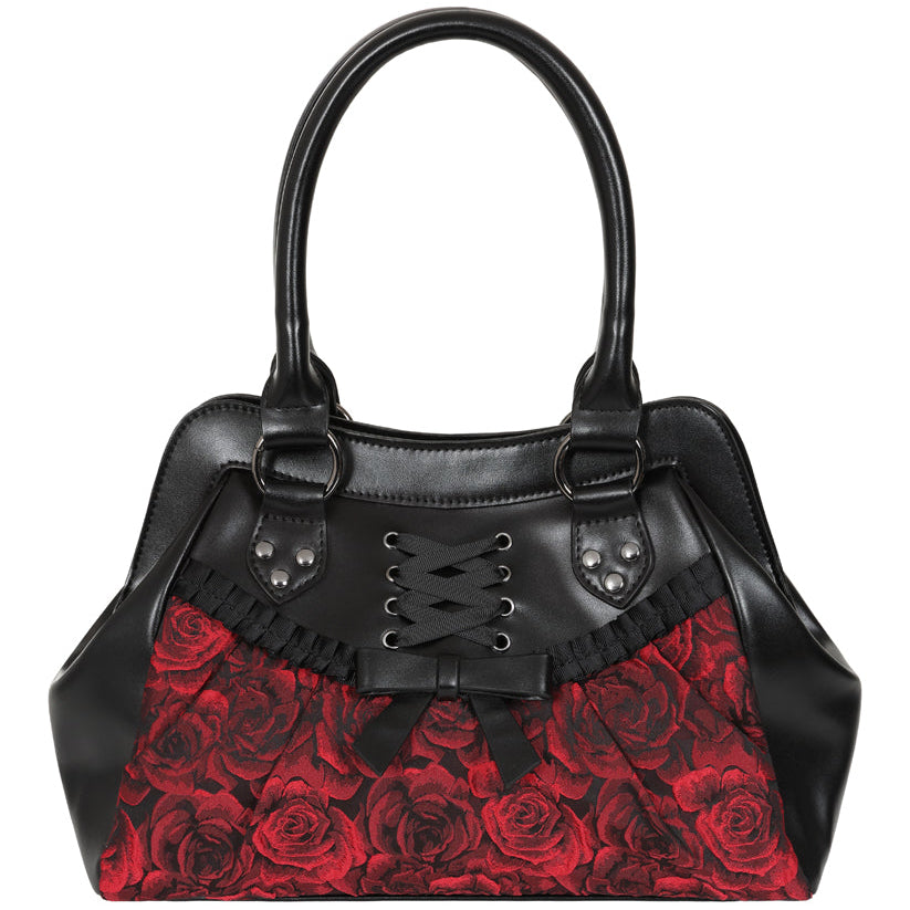 A black leather handbag with a red rose patterned front panel, double top handles, and decorative silver studs.