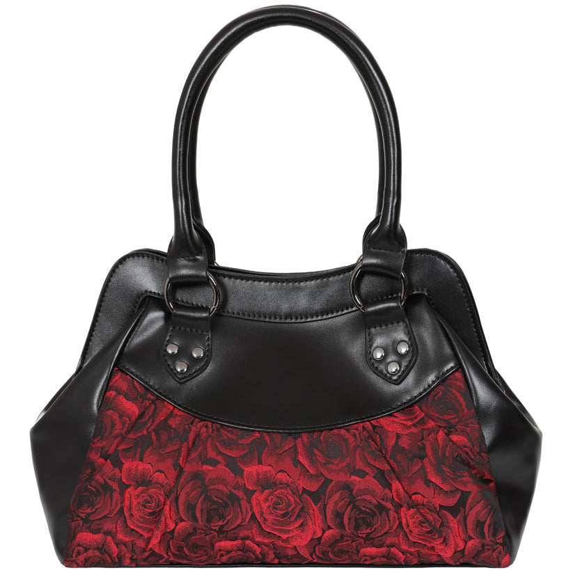 Black leather handbag with a red rose patterned front panel, featuring double top handles and decorative metal studs.