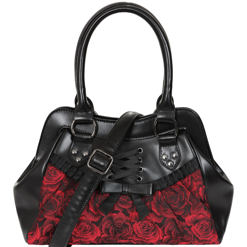 A black leather handbag with a red rose patterned fabric body, dual top handles, a detachable shoulder strap, and silver-tone hardware, shown on a plain white background.