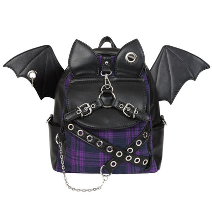Black faux-leather backpack with bat wings, cat ears, buckle straps, silver grommets, and a purple plaid front panel, shown on a white background.