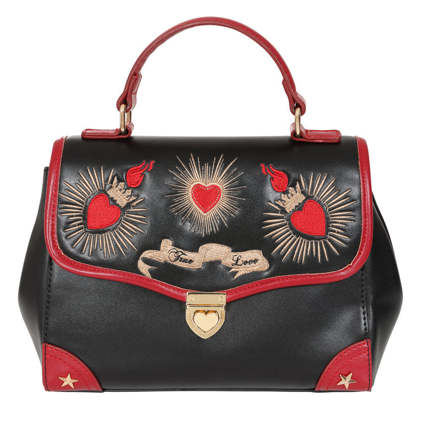 Black handbag with red accents and heart designs on a white background