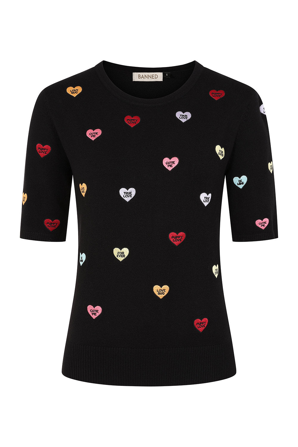 A black short-sleeve crewneck sweater with an all-over pattern of small metallic heart patches in red, gold, pink, and silver, displayed on a clean white background.
