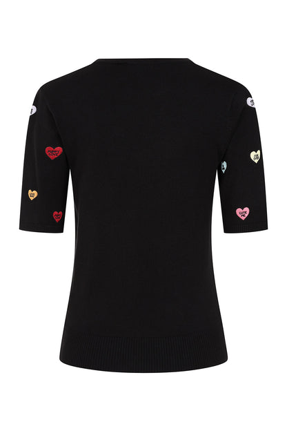 A black short-sleeve knit top with embroidered heart details in red, pink, and gold on the sleeves, shown against a plain white background.