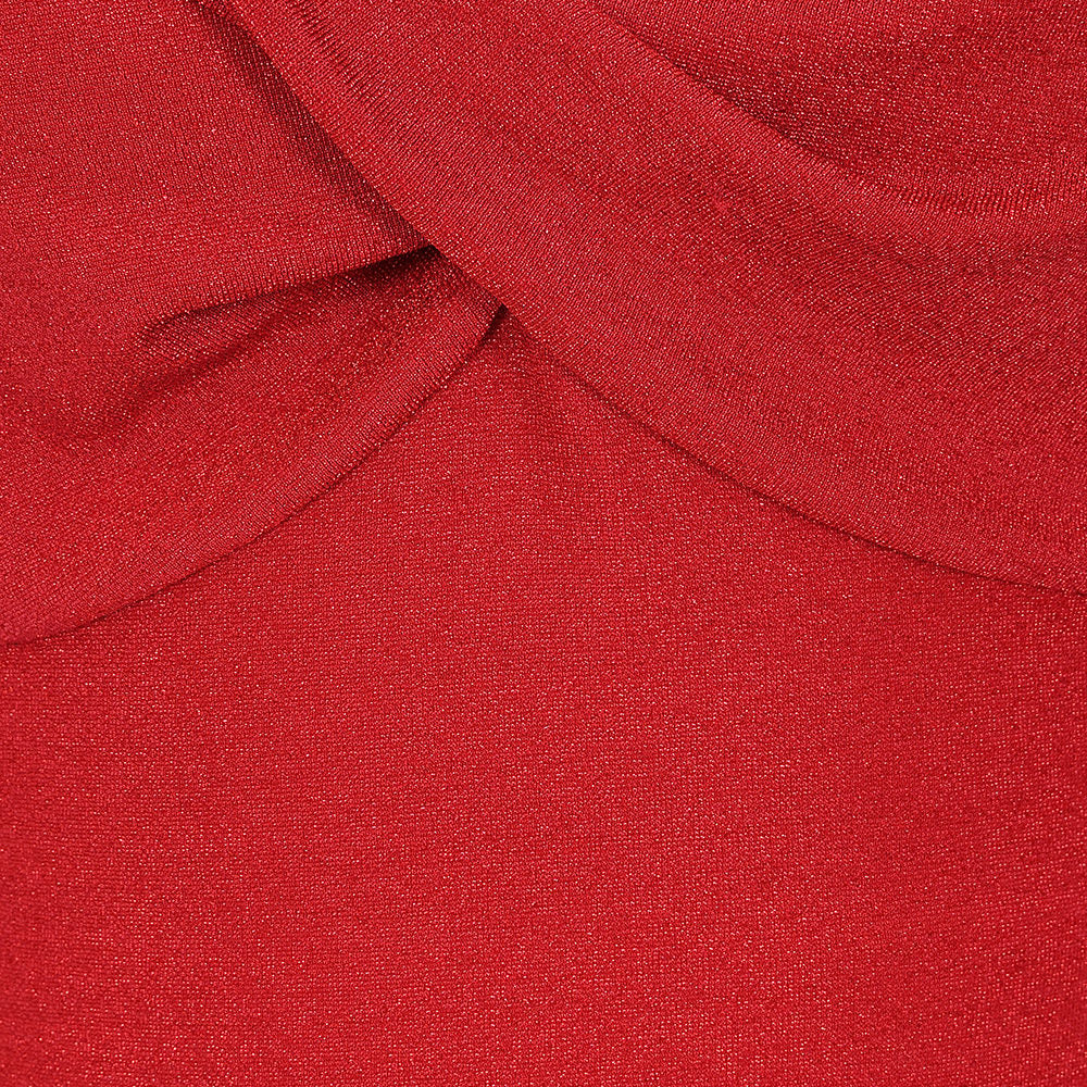 A close-up of a vibrant red knit fabric with a soft draped fold at the top.