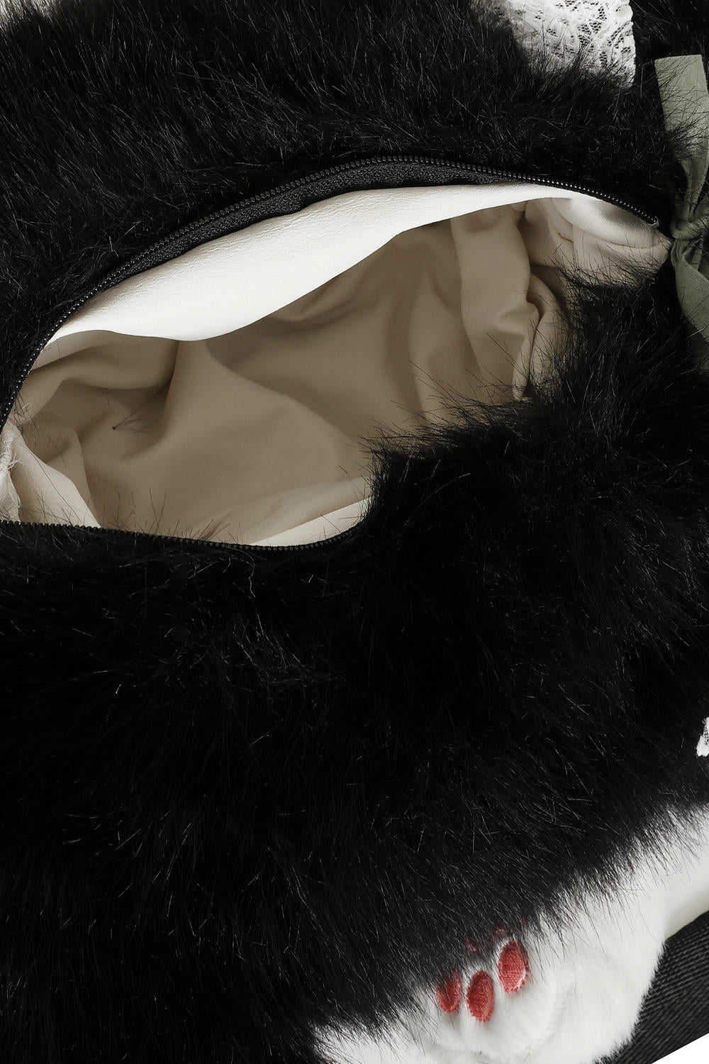 The BANNED Purrfect Mischief Backpack brings playful alternative charm to everyday styling. Designed in a soft black and white plush cat shape,
