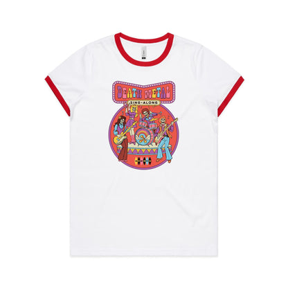 A white t-shirt featuring a colorful retro graphic print of the band Death Metal performing live, with 'DEATH METAL SING-ALONG' written in stylized multicolor letters at the top.