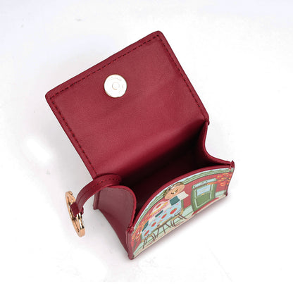 A small red leather card holder wallet with a gold snap button closure and a decorative illustrated paper insert, shown open on a white background.