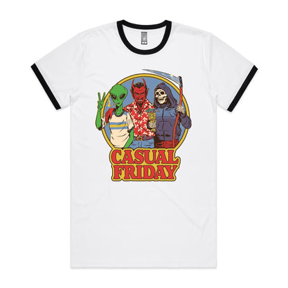 A white t-shirt featuring a colorful graphic print of three characters: a green alien smoking, a red devil in a red Hawaiian shirt holding a cocktail, and a skeleton in a purple hoodie holding a scythe. Below the illustration, the words 'CASUAL FRIDAY' are printed in large red letters with a yellow outline.