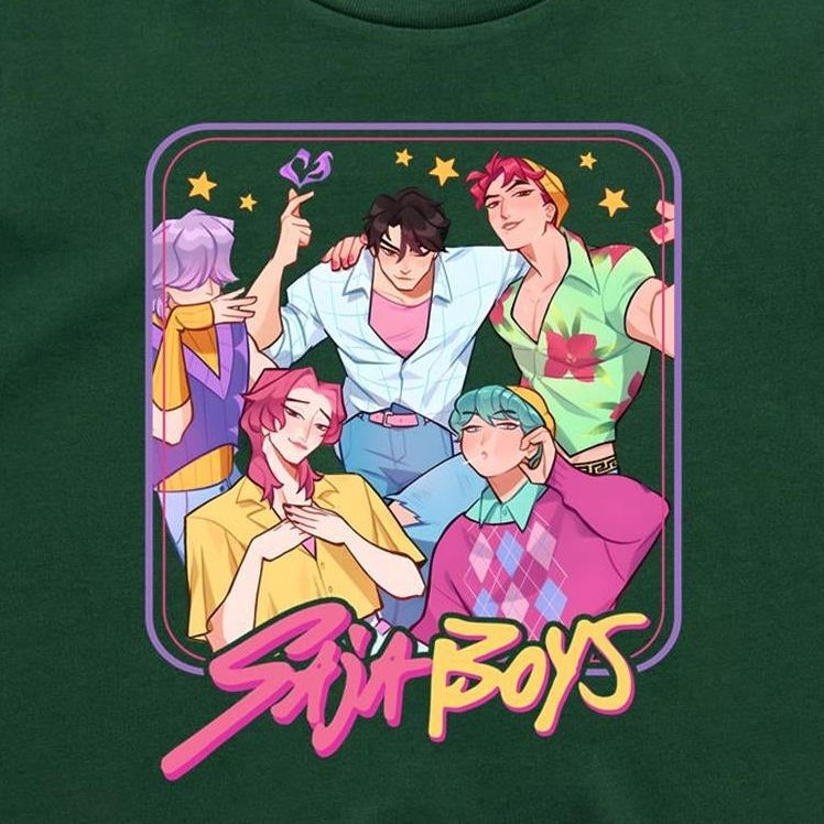 A close-up of a dark green t-shirt featuring a colorful graphic print of five illustrated anime-style boys with the text 'Stu Boys' in pink and yellow stylized lettering.