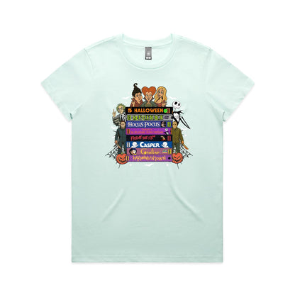 A graphic print featuring characters and movie titles from the Disney-Halloween franchise, including Holly, Jack Skellington, Michael, Sally, and Gus, arranged around stacked film title bars on a light beige background.
