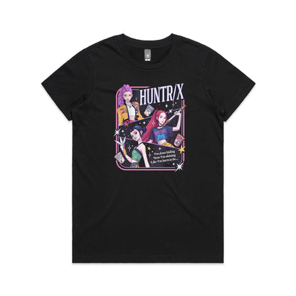 t-shirt featuring a colorful graphic print of three anime-style female characters with pink, purple, and black hair, holding snacks and a sword, with the text 'HUNTR/X' and 'I'm done hiding Now I'm shining Like I'm born to be.
