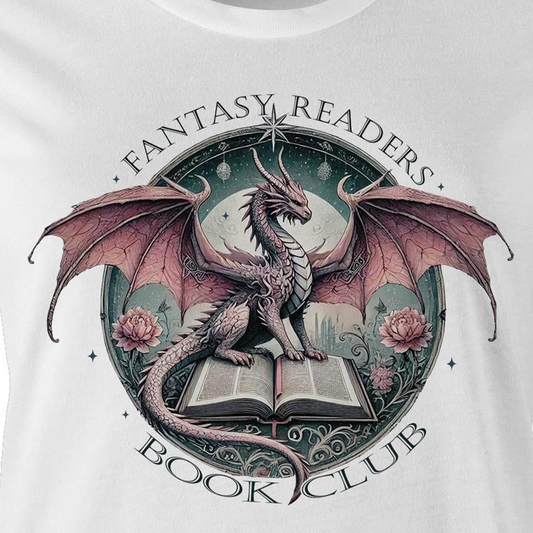 A close-up of a white t-shirt featuring a detailed graphic print of a fantasy dragon perched on an open book, with the text 'FANTASY READERS' above and 'BOOK CLUB' below.