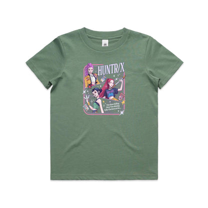 A close-up of a graphic t-shirt featuring three illustrated anime-style female characters with colorful hair and outfits, surrounded by stars and the text 'HUNTR/X'.