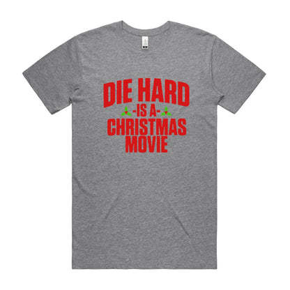 crew neck t-shirt with the text 'DIE HARD IS A CHRISTMAS MOVIE' printed in red and green colors.