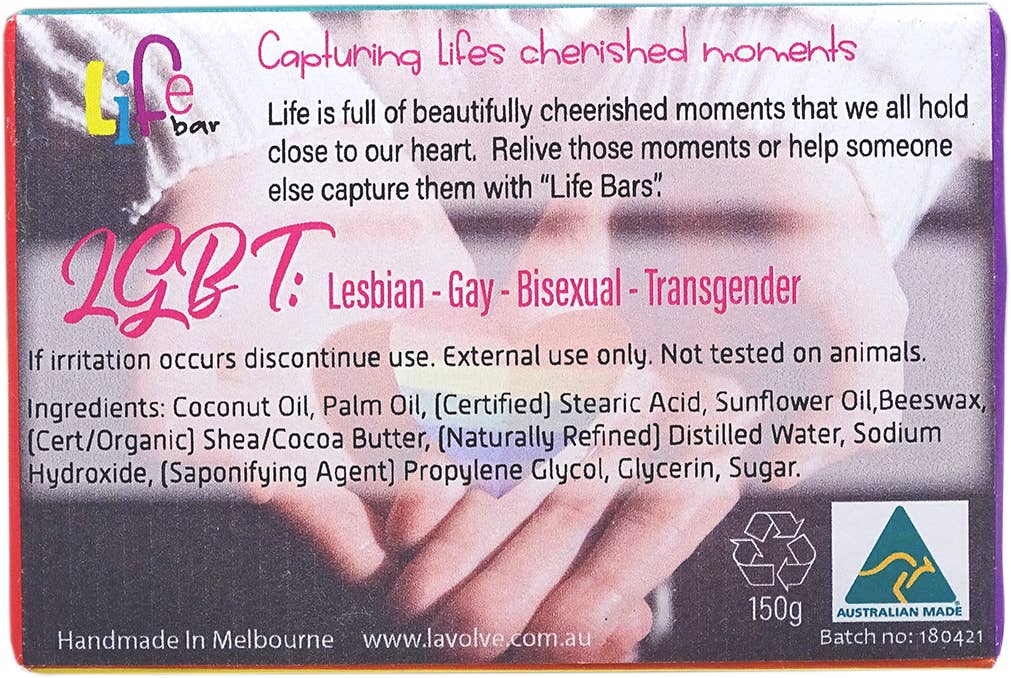 A rectangular handcrafted soap bar labeled 'Life bar' with a printed design of clasped hands and pink text reading 'LGBT+'. The front shows product information, ingredients, recycling symbol, 'Australian Made' badge, and '150g'.
