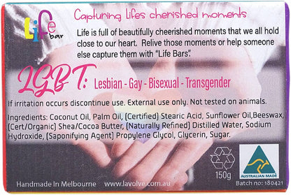 A rectangular handcrafted soap bar labeled 'Life bar' with a printed design of clasped hands and pink text reading 'LGBT+'. The front shows product information, ingredients, recycling symbol, 'Australian Made' badge, and '150g'.