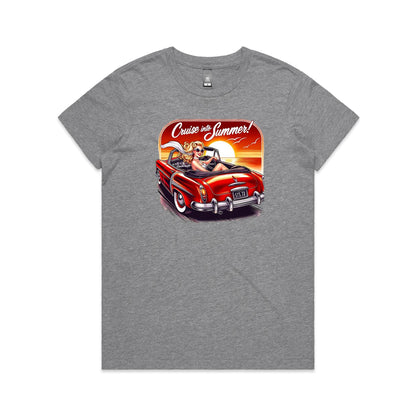 A graphic print on a black t-shirt featuring a retro-style illustration of a blonde woman in a red convertible car at sunset, with the text 'Cruise into Summer!' above.