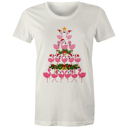 A women's black t-shirt with a printed design of pink flamingos forming a Christmas tree, with snow and Christmas decorations around.