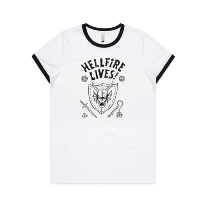 White ringer t-shirt with a red collar trim, featuring a black graphic print of a horned skull on a shield, the text 'HELLFIRE LIVES!', and fantasy-themed icons including dice, a sword, and a mace.