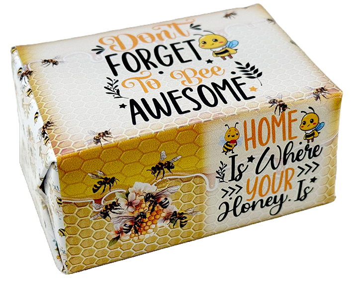 A square gift box with a honeybee-themed design, featuring the text 'Don't Forget To Bee Awesome' and 'Home Is Where Your Honey Is'. The box has a white top with a honeycomb pattern, yellow honeycomb panels on the sides, illustrated bees, flowers, and bumblebees, and is photographed on a clean white background.