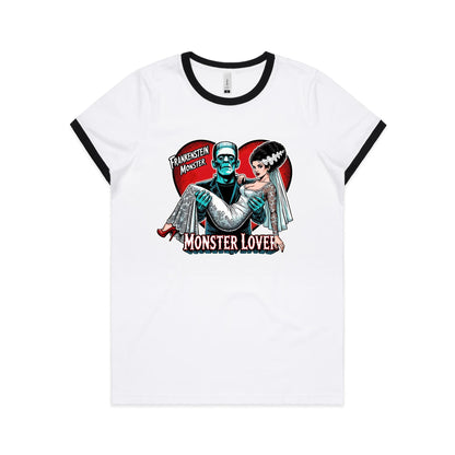 A close-up of a white crew-neck t-shirt featuring a retro Frankenstein-themed graphic print. The design shows a teal-colored Frankenstein Monster carrying a bride in a white lace wedding gown, set against a red heart background with the text 'FRANKENSTEIN MONSTER' and 'MONSTER LOVER'.