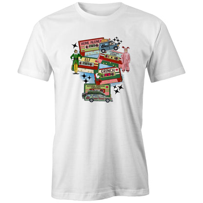A dark gray graphic print featuring Christmas-themed cassette tapes and characters from The Grinch movie, including a green and yellow Elf, a pink Grinch in a onesie, and a green station wagon with a Christmas tree. Text includes 'Home Alone', 'Elf', 'Grinch', and 'National Lampoons Christmas'.