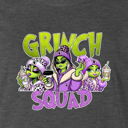A dark heather gray t-shirt featuring a colorful graphic print of three cartoon aliens dressed in purple and leopard-print clothing, holding drinks, with the text 'GRINCH SQUAD' in lime green and purple.