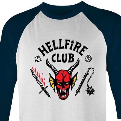 A 3/4 sleeve raglan t-shirt with a white body and dark navy blue sleeves. The front features a graphic print of a red horned devil skull with the text 'HELLFIRE CLUB' in black arched above it, flanked by a flaming sword and a mace.