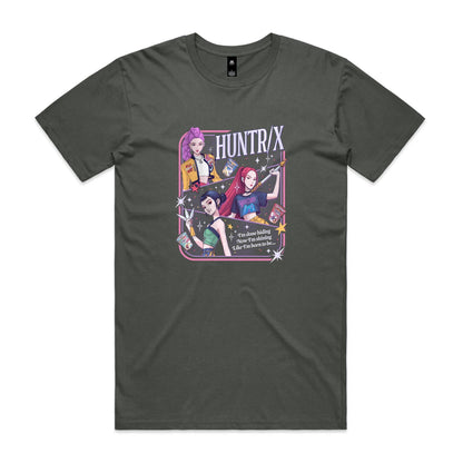 A close-up of a graphic t-shirt featuring three illustrated anime-style female characters with colorful hair and outfits, surrounded by stars and the text 'HUNTR/X'.