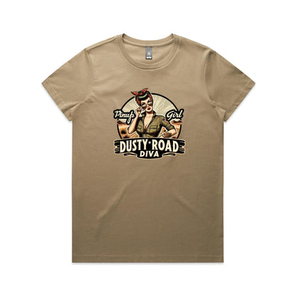 A graphic print on a white background featuring a retro-style pinup illustration of a woman with sunglasses, a red bandana, and an olive green shirt, with the text 'Pinup Girl' and 'Dusty Road Diva'.