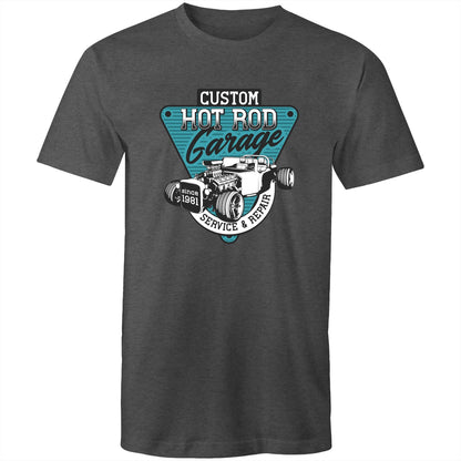 t-shirt featuring a large graphic print on the chest. The graphic is a teal and black triangular badge with the text 'CUSTOM HOT ROD Garage' and 'SERVICE & REPAIR since 1981', surrounding an illustration of a classic hot rod car with an exposed engine elements