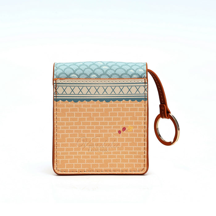 A small card holder wallet with a brown brick-patterned body, a light blue scalloped top panel, a decorative blue horizontal band, and a brown leather wristlet strap with a metal ring, shown on a white background.