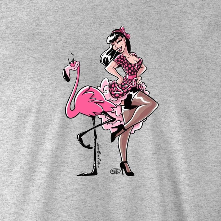 A heather gray t-shirt featuring a retro-style graphic print of a pin-up girl with black-and-white hair and a pink bow, posing with a pink flamingo.