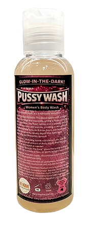 A bottle of 'Pussy Wash' women's body wash with a clear cap and a black label featuring pink and white text, containing a beige-colored liquid.