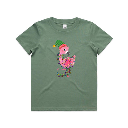 A pink cartoon flamingo wearing a green and red plaid Santa hat, wrapped in colorful Christmas lights, printed on a white fabric background.