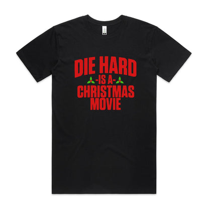 A black t-shirt with the text 'DIE HARD IS A CHRISTMAS MOVIE' printed in red and white.