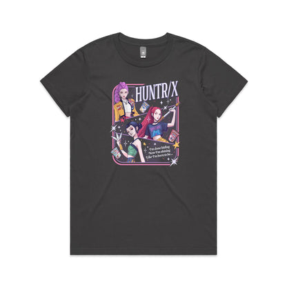t-shirt featuring a colorful graphic print of three anime-style female characters with pink, purple, and black hair, holding snacks and a sword, with the text 'HUNTR/X' and 'I'm done hiding Now I'm shining Like I'm born to be.