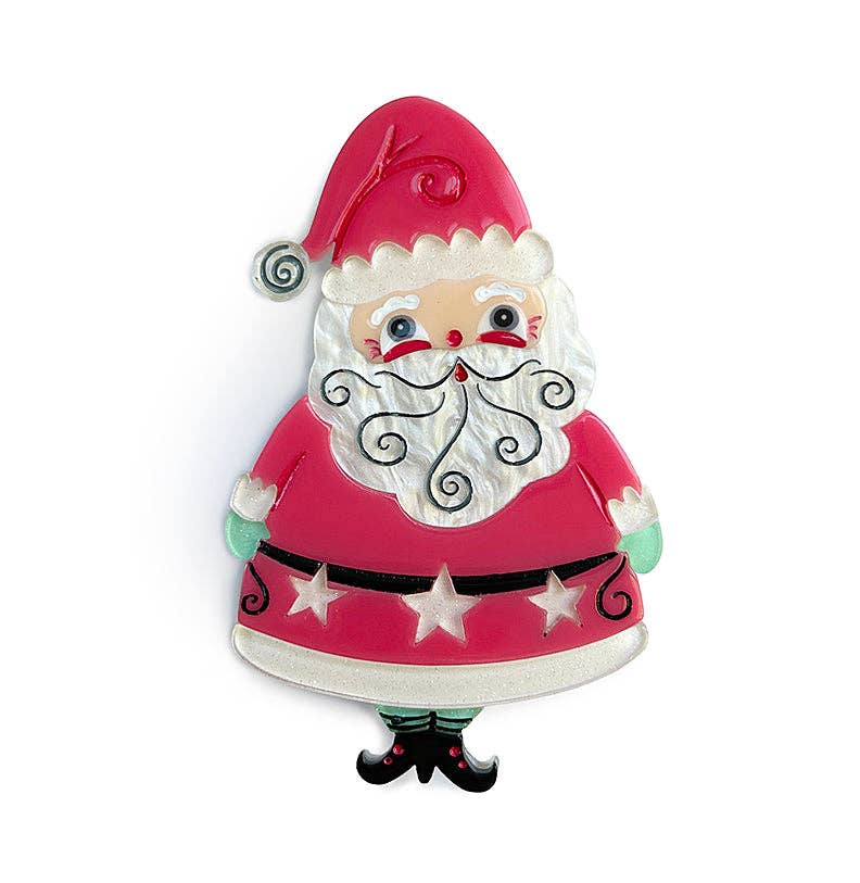A festive Santa Claus figurine or ornament with a glossy red hat and coat, white beard and trim, black belt with white stars, green cuffs, and black shoes, shown on a plain white background.