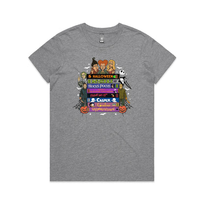 A graphic print featuring characters and movie titles from the Disney-Halloween franchise, including Holly, Jack Skellington, Michael, Sally, and Gus, arranged around stacked film title bars on a light beige background.