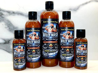 Five bottles of Willy Wash Men's Body Wash in various 250ml and 500ml sizes, arranged in a row against a white marble background. The bottles are filled with amber-colored liquid and feature black caps and colorful labels with a cartoon graphic of a man in a cowboy hat.