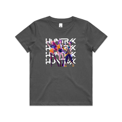 A close-up of a t-shirt featuring a graphic print of three stylized female anime characters in colorful outfits, overlaid with the word 'HUNTRX' repeated vertically in large white letters.