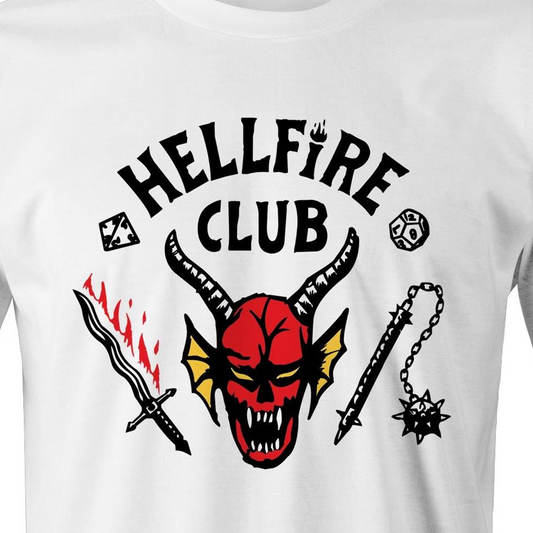 White short-sleeve t-shirt featuring a graphic print of a red horned devil head with the text 'HELLFIRE CLUB' in black arched above it, accompanied by a black sword with red flames, a black spiked mace, and dice icons.