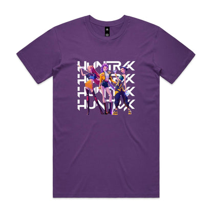 graphic t-shirt featuring three stylized female anime characters standing in front of a large white repeating 'HUNTRX' logo. The shirt fabric is visible, and the graphic is printed in vibrant shades of purple, yellow, orange, and black.